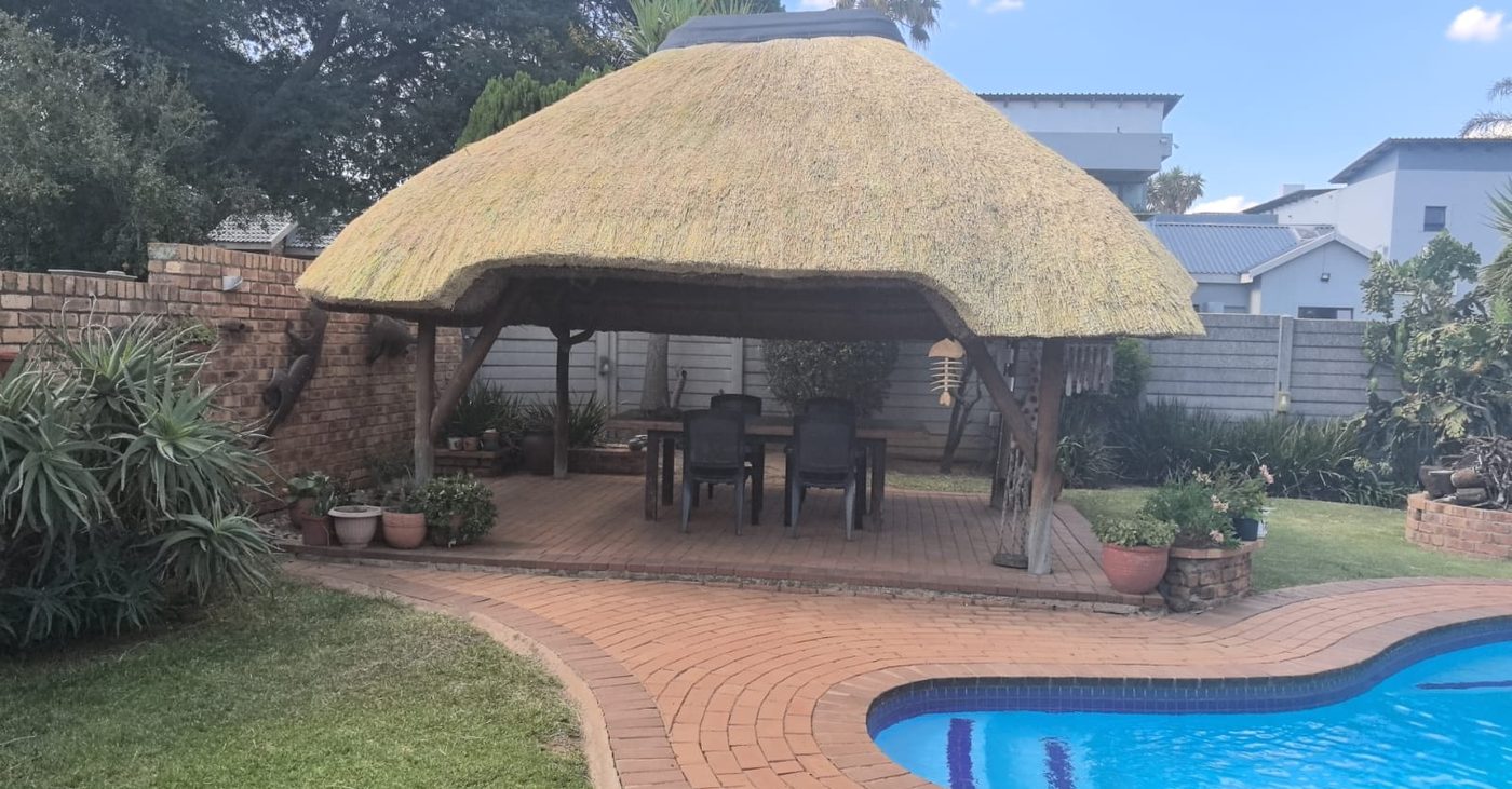 Thatch lapa built next to a pool